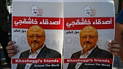 People hold posters of slain Saudi journalist Jamal Khashoggi, near the Saudi Arabia consulate in Istanbul, marking the two-year anniversary of his death, Friday, Oct. 2, 2020