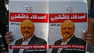 People hold posters of slain Saudi journalist Jamal Khashoggi, near the Saudi Arabia consulate in Istanbul, marking the two-year anniversary of his death, Friday, Oct. 2, 2020