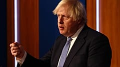 Britain's Prime Minister Boris Johnson speaks at a press conference in London's Downing Street, Wednesday Dec. 8, 2021, 
