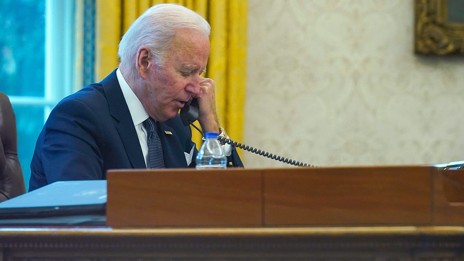 President Joe Biden talks on the phone with Ukrainian President Volodymyr Zelenskyy in December..