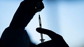 A medical staff member prepares the Pfizer-BioNTech COVID-19 vaccine