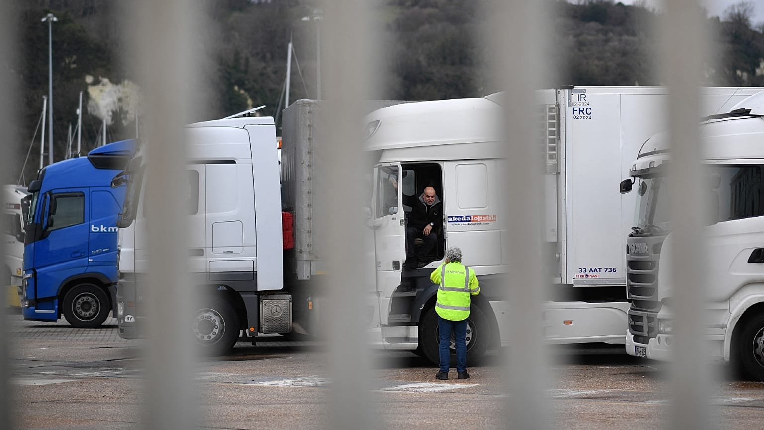 Drivers wait with their parked-up freight trucks at the Motis freight clearance centre at the port of Dover on the south coast of England on January 15, 2021