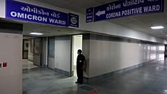 A security guard stands in position outside a ward being prepared for the omicron coronavirus variant at Civil hospital in Ahmedabad, India, Dec. 6, 2021. 