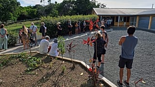 People queue outside a school to vote in a referendum in Noumea, New Caledonia, Sunday December 12, 2021