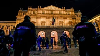 Italian Carabinieri police patrol outside La Scala opera house for the premiere of Verdi's Macbeth in Milan, Italy, Tuesday, Dec. 7, 2021.