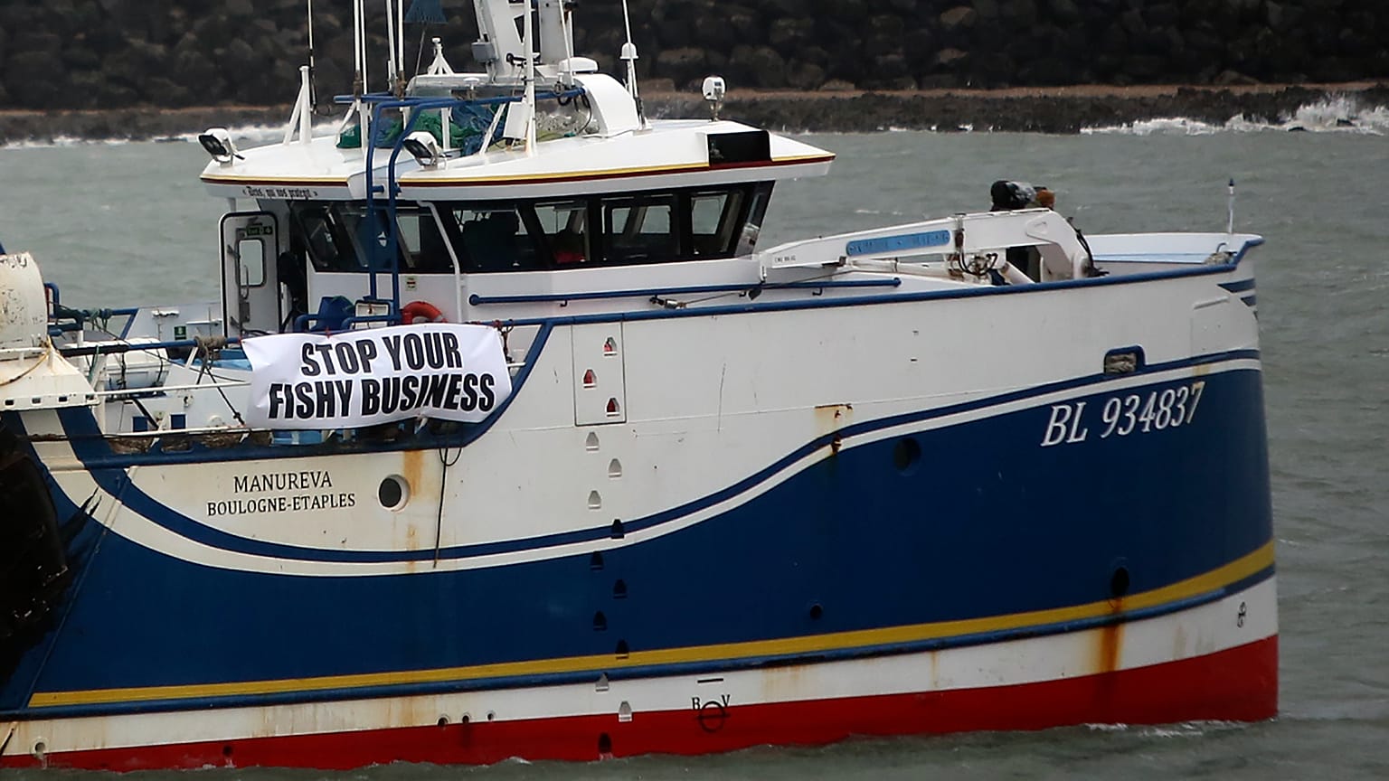 French fishing boats block the entrance to the port of Calais, northern France, Friday, Nov. 26, 2021. 