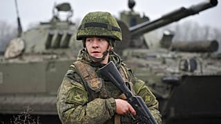 A Russian army soldier takes part in drills at the Kadamovskiy firing range in the Rostov region in southern Russia, Friday, Dec. 10, 2021.