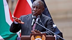 South African President Cyril Ramaphosa addresses the media after meeting with his Kenyan counterpart Uhuru Kenyatta in Pretoria, South Africa, Tuesday Nov. 23, 2021.