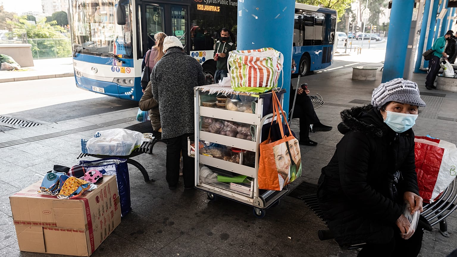 People with face masks waiting for the bus in old Nicosia