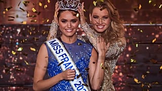 Miss Ile-de-France Diane Leyre is crowned by Miss France 2021 Amandine Petit at the end of the the Miss France 2022 beauty contest in Caen, on December 11, 2021.
