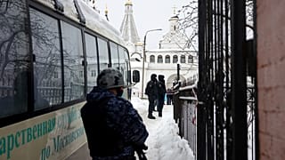 Police officers stand guard at the Vvedenskiy Vladychniy convent in Serpukhov
