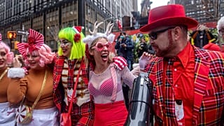 People participate in Santa Con near Times Square on Saturday, Dec. 11, 2021, in New York.