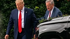 President Donald Trump talks to White House Chief of Staff Mark Meadows