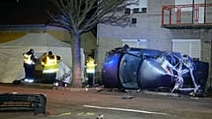 Hungarian police officers work at the scene of a fatal crash, in Morahalom, Hungary, Tuesday, Dec. 14, 2021. 