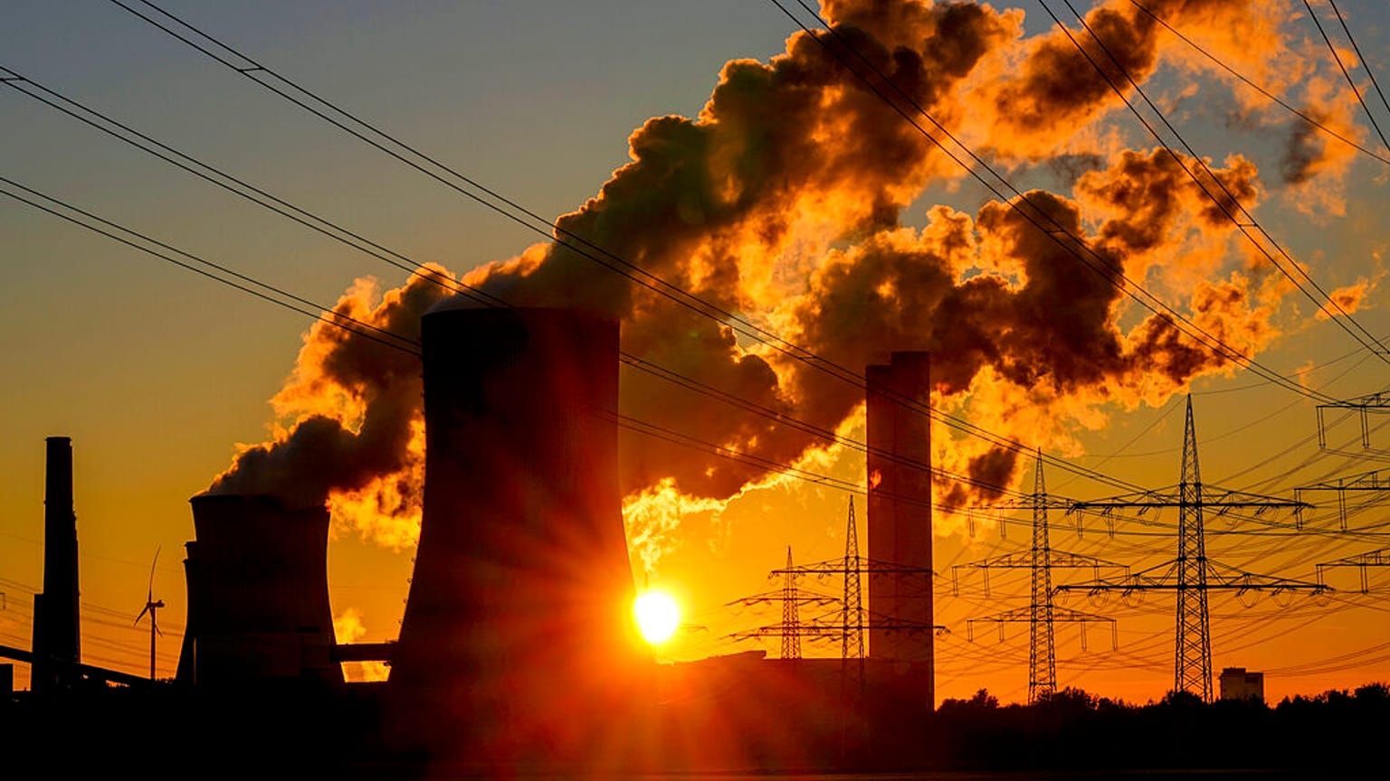 Steam pours from the chimneys of a coal-fired power station in Niederaussem, Germany, October 2021