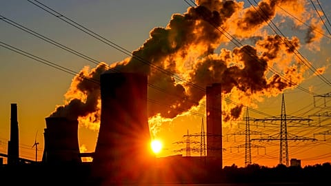 Steam pours from the chimneys of a coal-fired power station in Niederaussem, Germany, October 2021