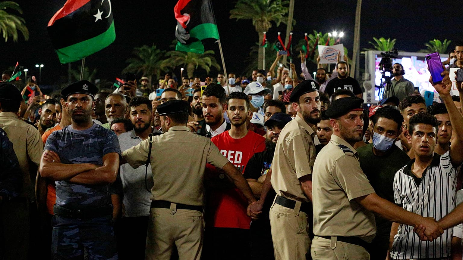 Demonstrators protest in Tripoli, Libya, on Sept. 24, 2021, in opposition to parliament passing a vote of no-confidence in the transitional government.