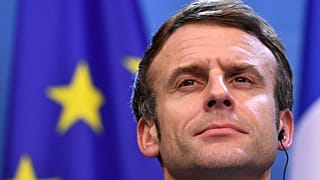 French President Emmanuel Macron addresses a media conference at the conclusion of an EU Summit in Brussels, Friday, Dec. 17, 2021.