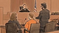 Attorney Eric Nelson, right, speaks to US District Judge Paul Magnuson during a hearing where ex-police officer Derek Chauvin, centre, pleaded guilty to a federal charge.