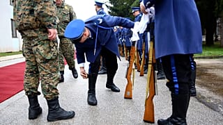 A member of the Bosnian Honour guard prepares before a ceremony in Rajlovac barracks near the capital Sarajevo, Bosnia, Friday, Dec. 10, 2021.
