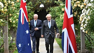 Britain's Prime Minister Boris Johnson, right, walks with Australian Prime Minister Scott Morrison after their meeting, in the garden of 10 Downing Street, June 15, 2021. 
