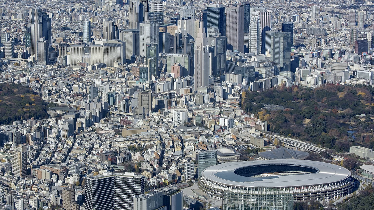 The National Stadium with skyscrapers