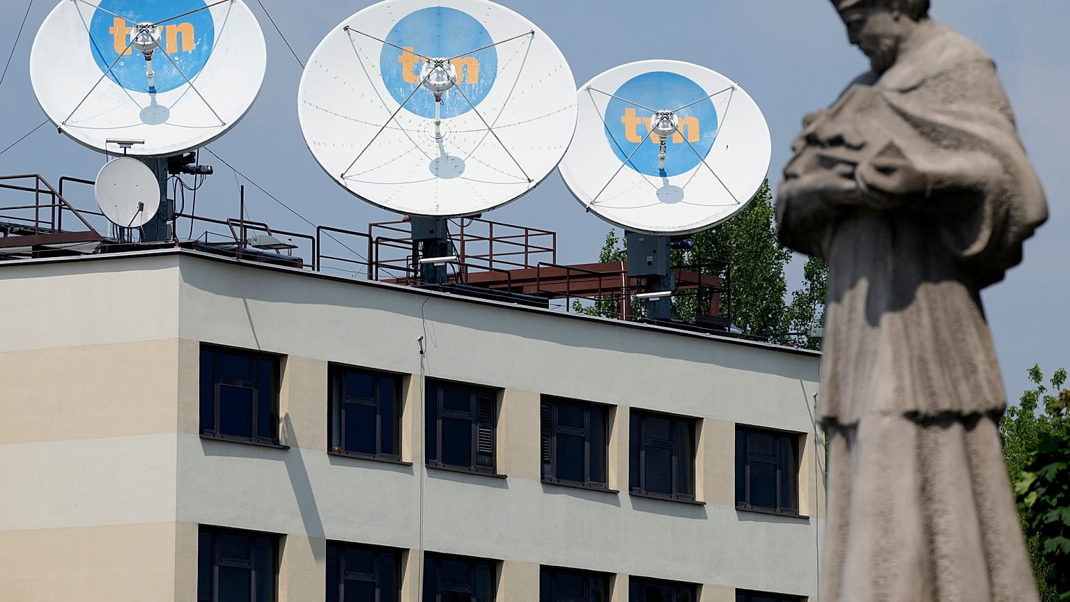 FILE - Warsaw headquarters of Poland's TVN broadcaster that is owned by the U.S. company Discovery Inc., in Warsaw, Poland, July 2021.