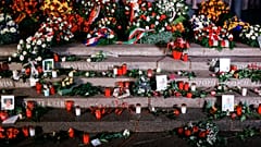 Flowers, candles and wreaths left at the memorial "Der Riss" commemorating the victims of the 2016 terrorist attack at Breitscheidplatz square in Berlin, on Dec. 19, 2021.