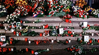 Flowers, candles and wreaths left at the memorial "Der Riss" commemorating the victims of the 2016 terrorist attack at Breitscheidplatz square in Berlin, on Dec. 19, 2021.