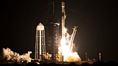 File-This NASA handout image shows a SpaceX Falcon 9 rocket launching with NASA's Imaging X-ray Polarimetry Explorer (IXPE) spacecraft, Dec 9, 2021. 