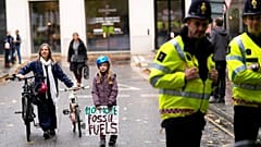 young people protesting in London ahead of the 26th U.N. Climate Change Conference (COP26).
