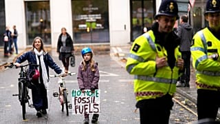 young people protesting in London ahead of the 26th U.N. Climate Change Conference (COP26).