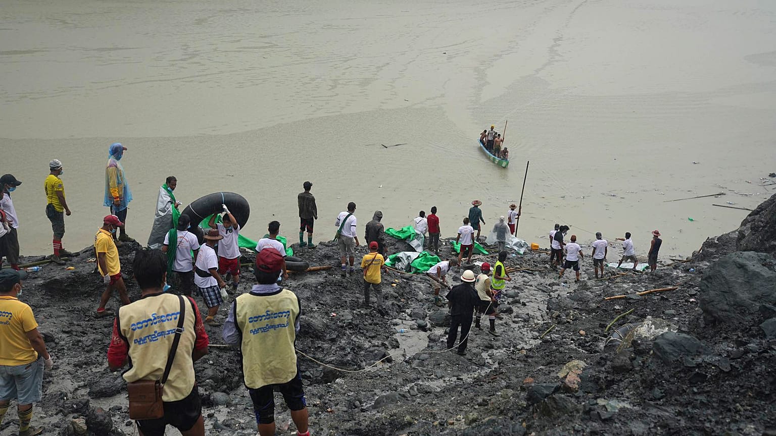 Rescuers recover bodies in Hpakant, Kachin State, Myanmar, on July 3, 2020, following a landslide at a jade mine.