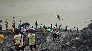 Rescuers recover bodies in Hpakant, Kachin State, Myanmar, on July 3, 2020, following a landslide at a jade mine.