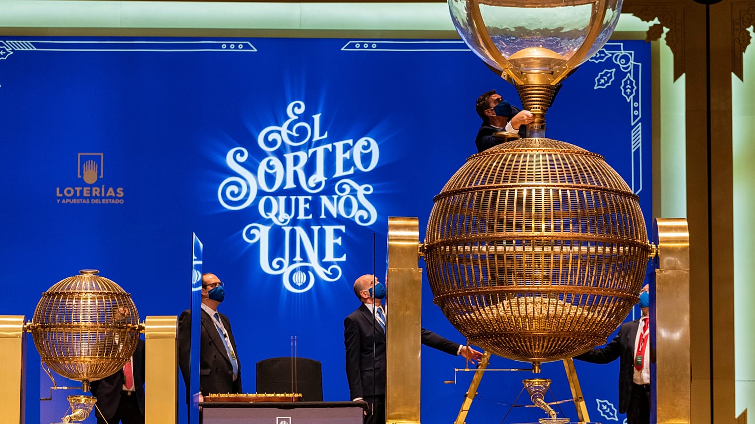 Workers prepare numbered lottery balls at Madrid's Teatro Real opera house during Spain's bumper Christmas lottery draw known as The Fat One, in Madrid, Spain, Dec. 22, 2021.