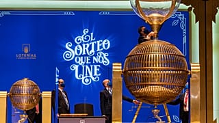 Workers prepare numbered lottery balls at Madrid's Teatro Real opera house during Spain's bumper Christmas lottery draw known as The Fat One, in Madrid, Spain, Dec. 22, 2021.
