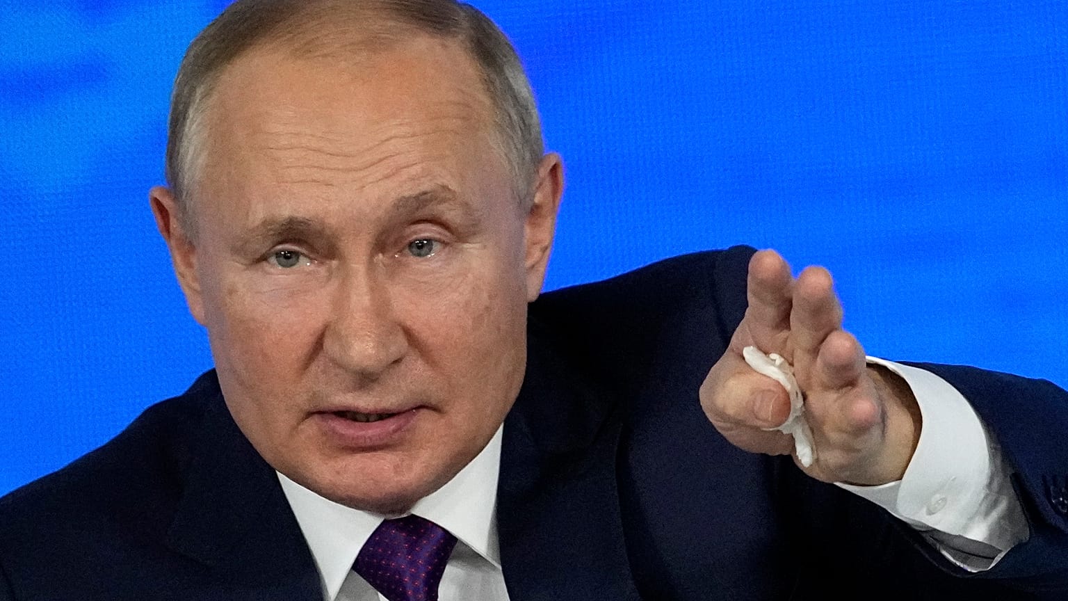 Russian President Vladimir Putin gestures while speaking during his annual news conference in Moscow, Russia, Thursday, Dec. 23, 2021