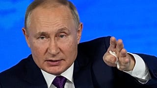Russian President Vladimir Putin gestures while speaking during his annual news conference in Moscow, Russia, Thursday, Dec. 23, 2021
