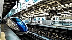 Image shows a high speed train entering a train station. The EU has committed to simplifying transport and rail travel across the bloc.