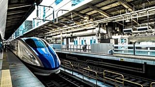 Image shows a high speed train entering a train station. The EU has committed to simplifying transport and rail travel across the bloc.