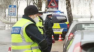 Federal police officers stop cars coming from the Netherlands for an inspectional near the border at the Horbach district in Aachen, Germany, April 6, 2021. 