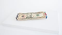 A $10 dollar bill version of the Tug of War.