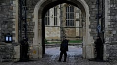 Police guard the Henry VIII gate at Windsor Castle at Windsor, England on Christmas Day