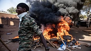 Protestors take to the streets of Burkina Faso's capital Ouagadougou Saturday Nov. 27, 2021, calling for President Roch Marc Christian Kabore to resign