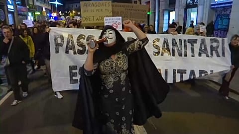 Thousands protest new virus restrictions in Spain
