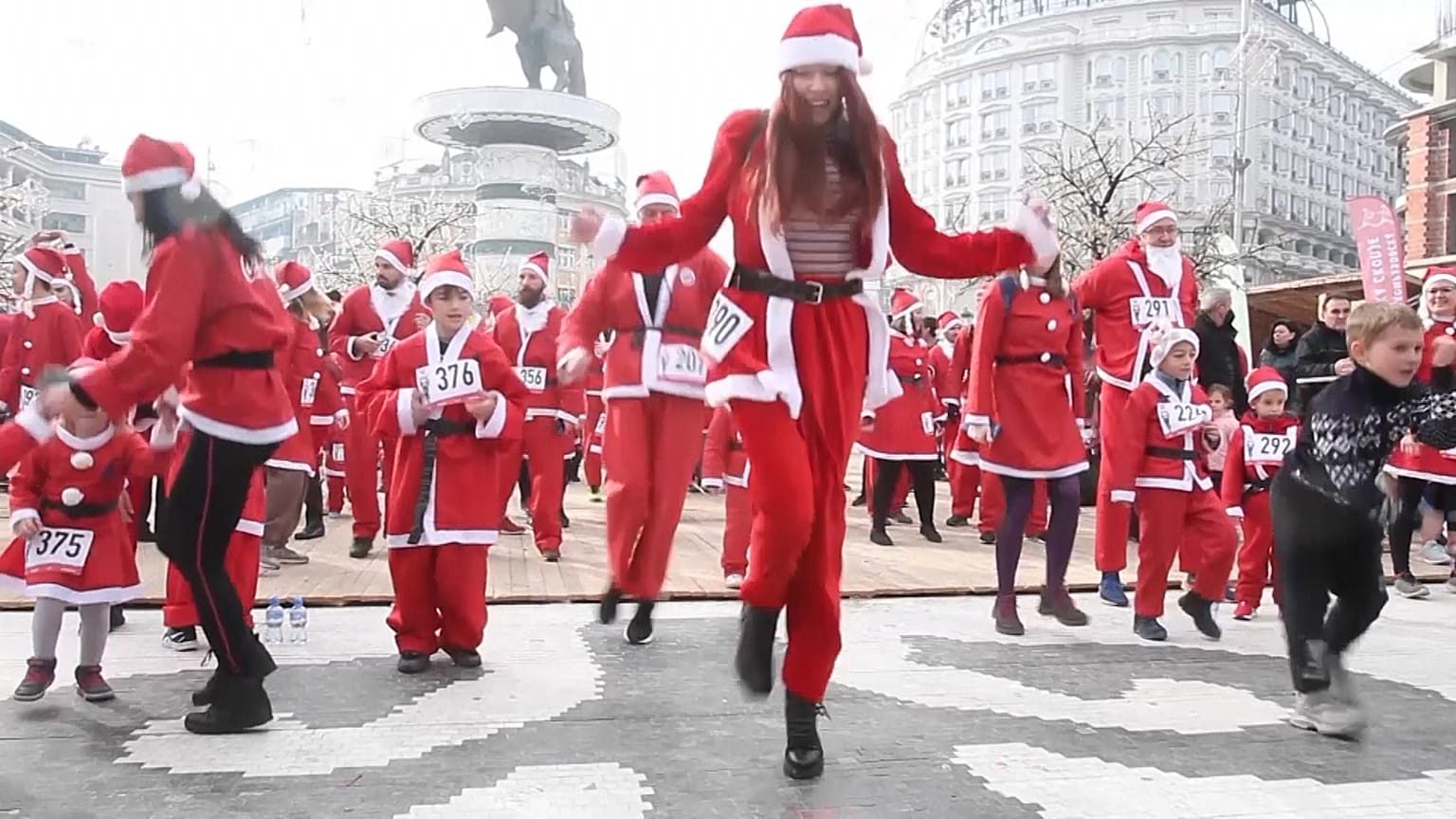 Runners in costumes dancing during warm up