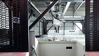 Image shows an AI-powered zenrobotics recycling robot at work.