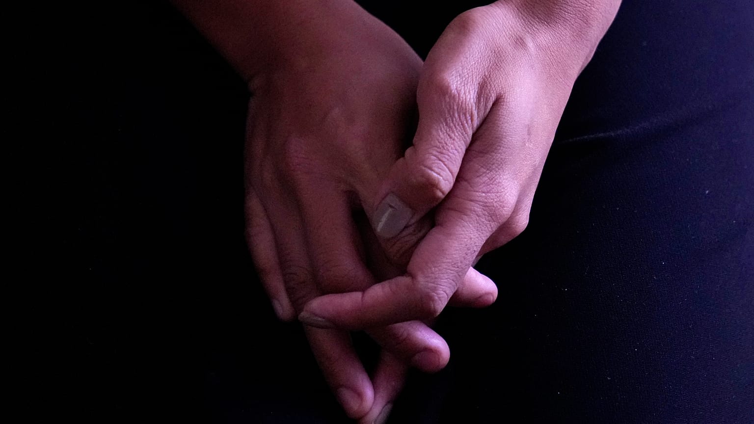 A Myanmar refugee, 26, who fled during the violence in the town of Mindat in Chin state, northwestern Myanmar, talks to the Associated Press at an undisclosed location.