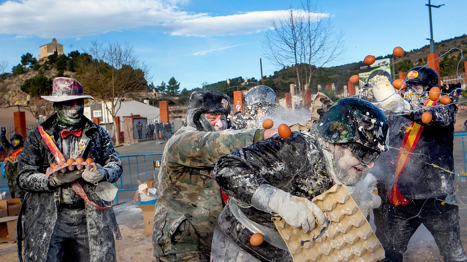 Revellers take part in the Els Enfarinats festival, in the town of Ibi near Alicante, Spain, Tuesday 28 Dec, 2021 