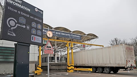 Lorries pass the customs checkpoint at the Eurotunnel train link with Europe in Folkestone, England, on Jan. 1, 2021.